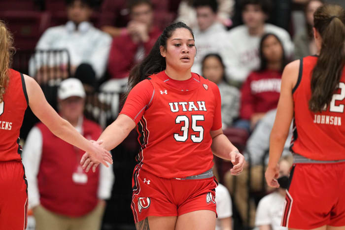 Jan 20, 2023; Stanford, California, USA; Utah Utes forward Alissa Pili (35) is congratulated by guard Gianna Kneepkens (left) and forward Jenna Johnson (right) during the third quarter against the Stanford Cardinal at Maples Pavilion. Mandatory Credit: Darren Yamashita-USA TODAY Sports
